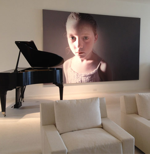 Living Room: Viennese painter Gottfried Helnwein’s dramatic portrait of a young girl captivated and engages the viewer. 